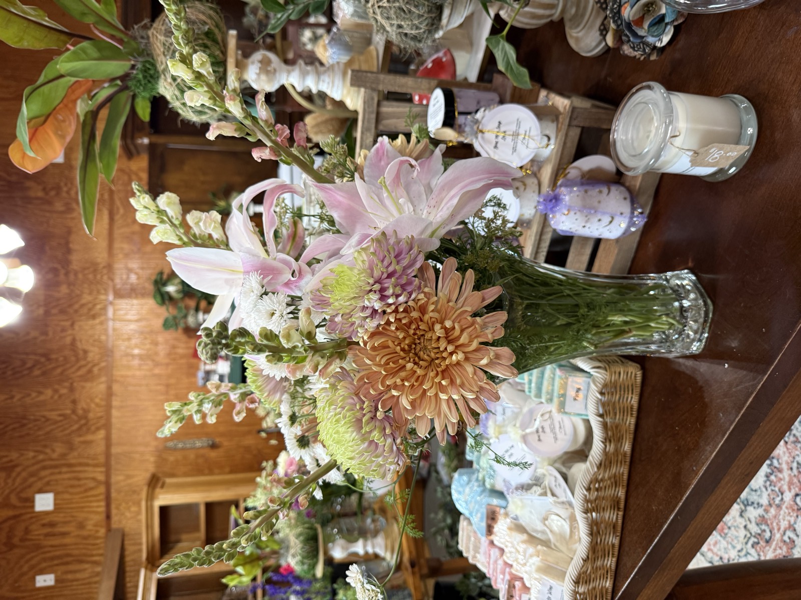 Elegant vase arrangement of lilies, chrysanthemums, and snapdragons